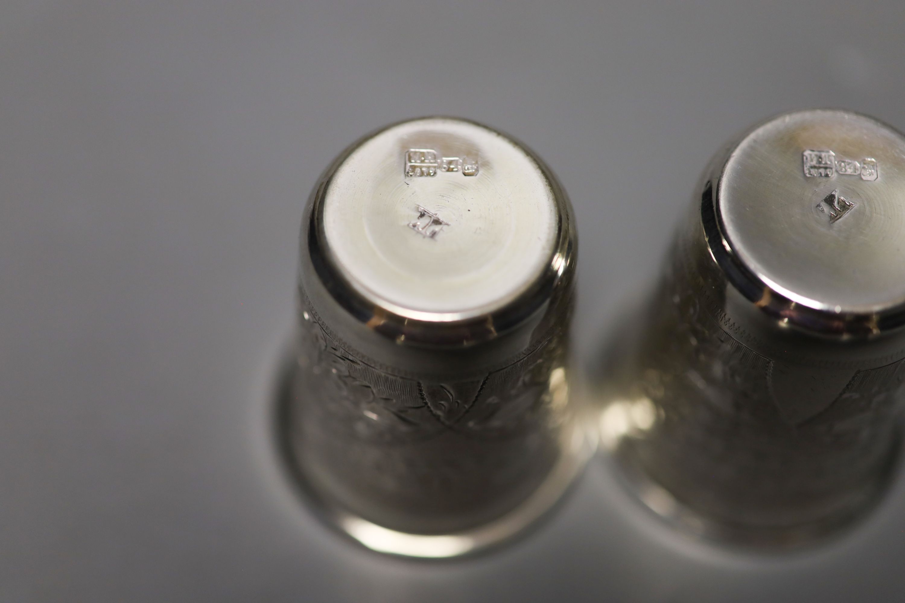 A pair of 19th century Russian engraved 84 zolotnik tots, dated 1879, 48mm, 52 grams.